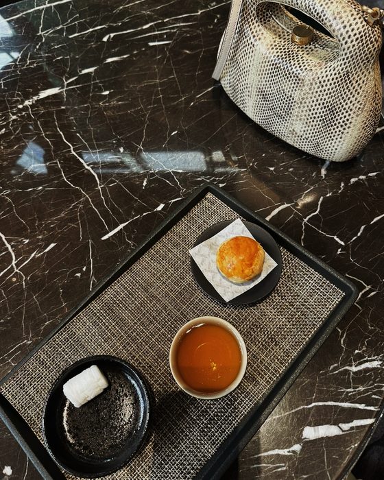 Tea and a pastry on marble