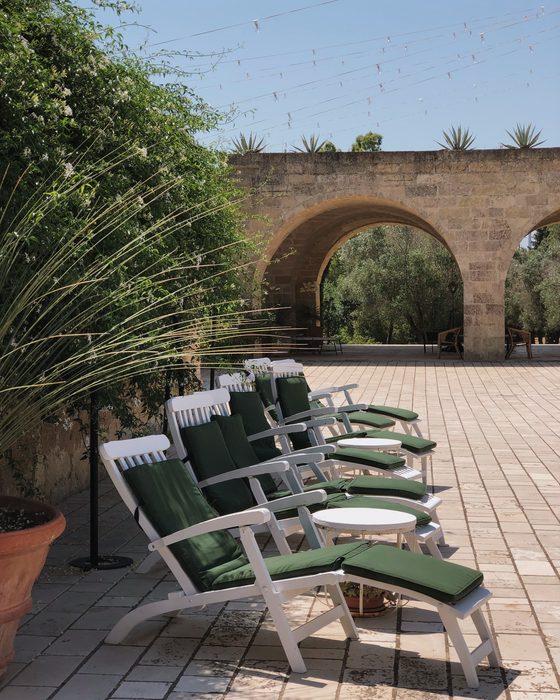 Deck chairs in the arched courtyard