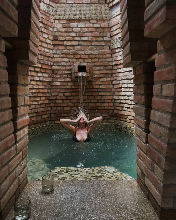 The spouted plunge pool in the brick tower